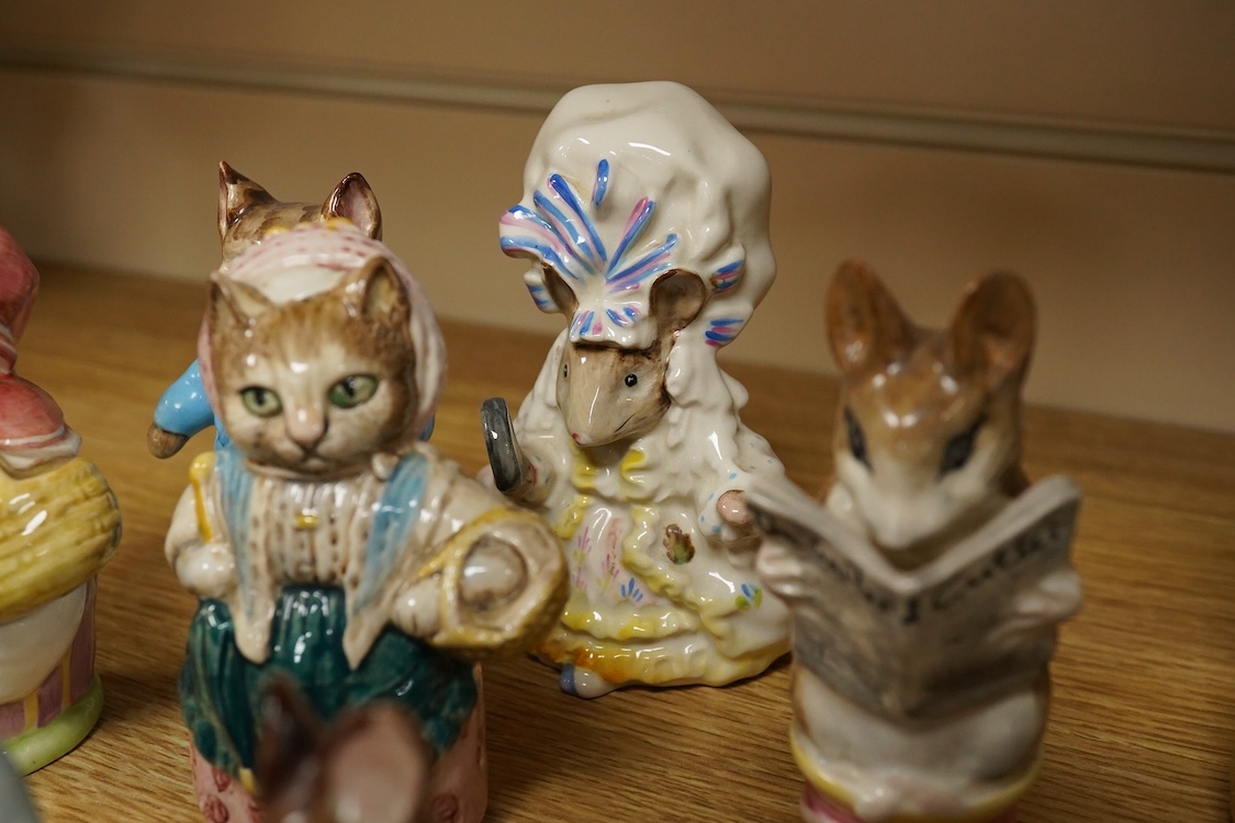 A collection of Beatrix Potter figures, three Staffordshire Dalmatians and a Copenhagen Dalmatian, tallest 16cm high